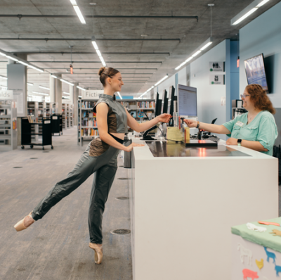 ballerina at the library desk