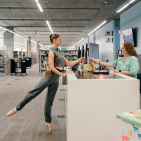 ballerina at the library desk
