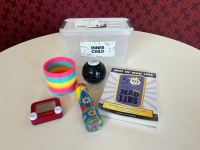 Best of Madlibs book, Rainbow Slinky, Magic 8 Ball, a kaleidoscope, and a Etch a Sketch.