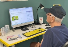 Man using a computer in the library