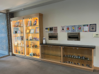 Wooden display cases filled at the library
