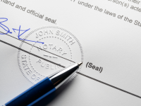 Piece of paper with a notary seal and a signature at the bottom