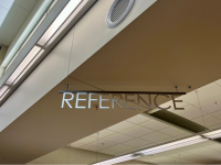 Reference sign hanging from the ceiling in the library