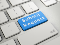 White keyboard with a blue key reading "Submit Request"