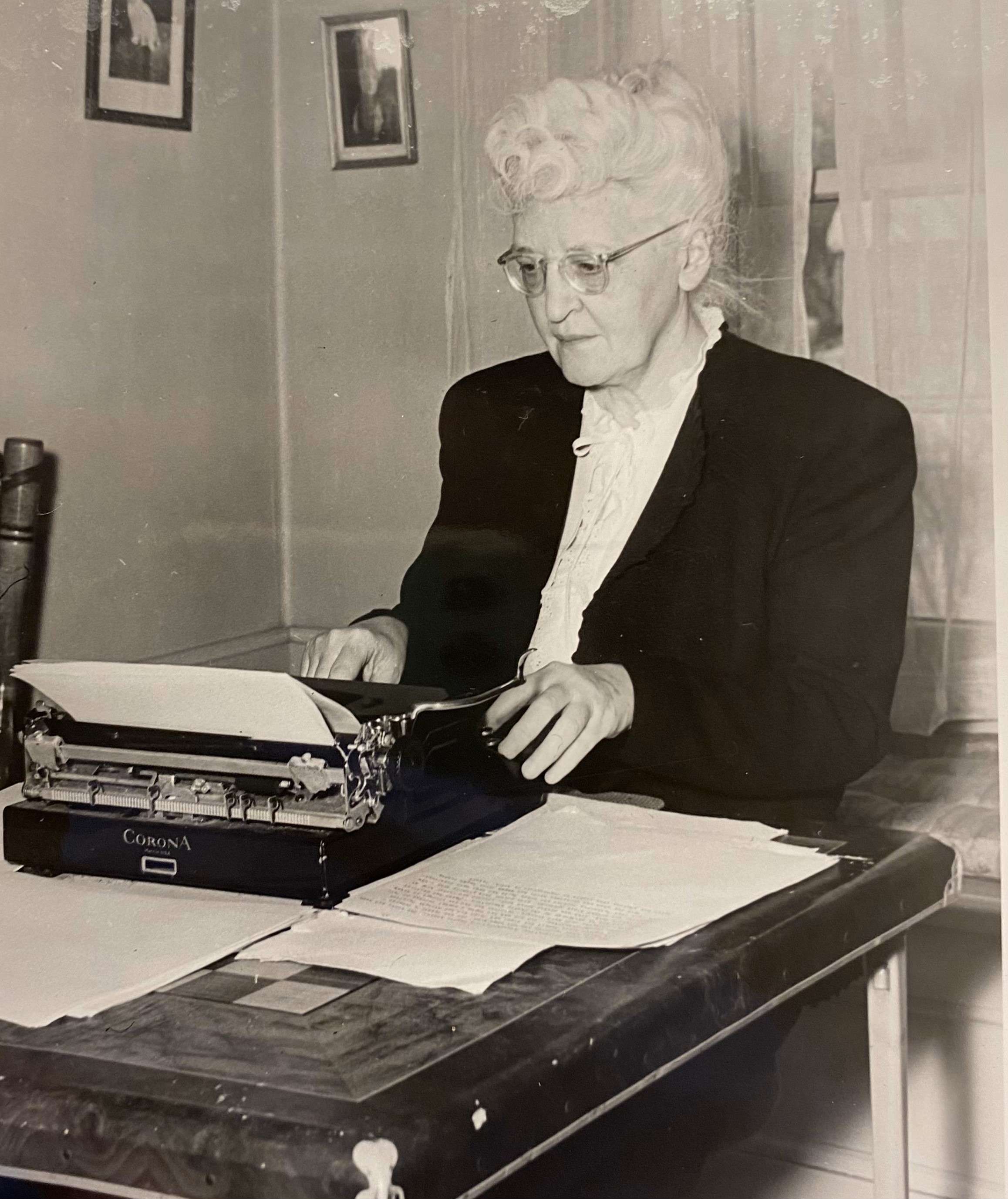 Author Ruth Suckow typing on a typewriter